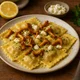 Ravioli mit Pfifferlingen und Ziegenkäse in Zitronen-Olivenöl-Sauce – Bild 1